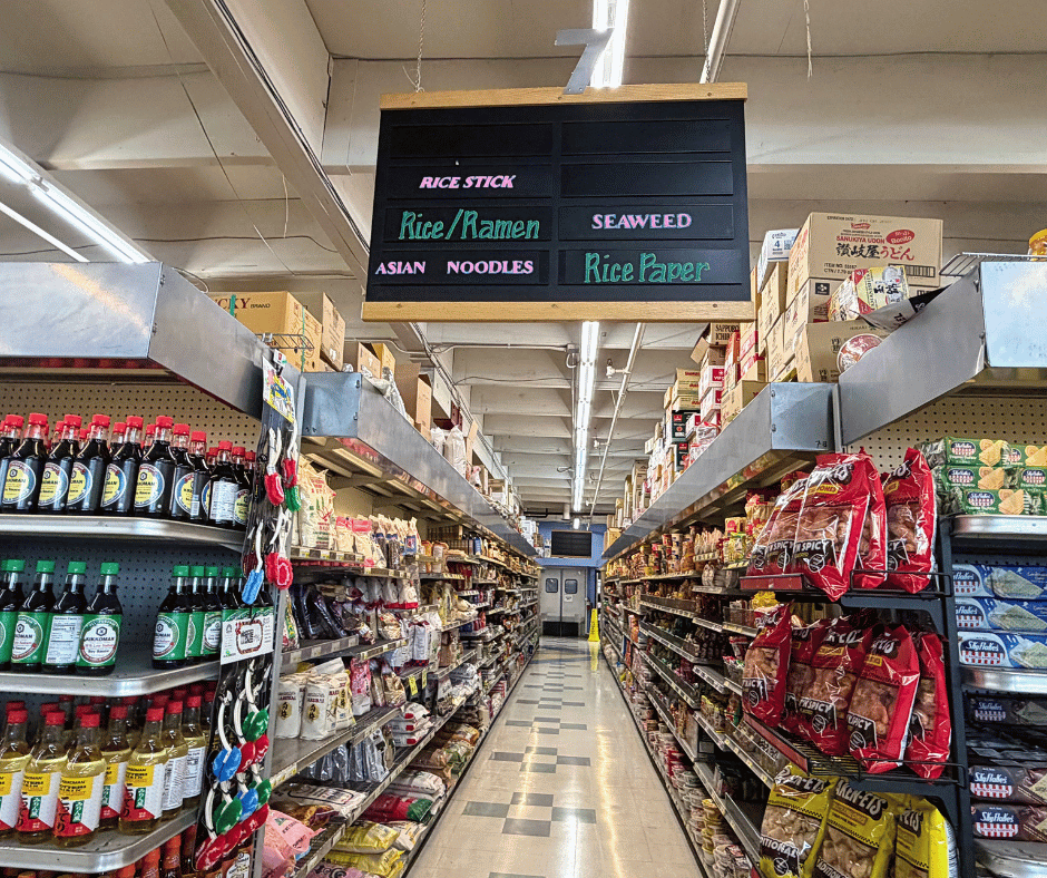 Asian market in Anchorage with shelves stocked with noodles, rice, sauces, snacks, and specialty Asian groceries.